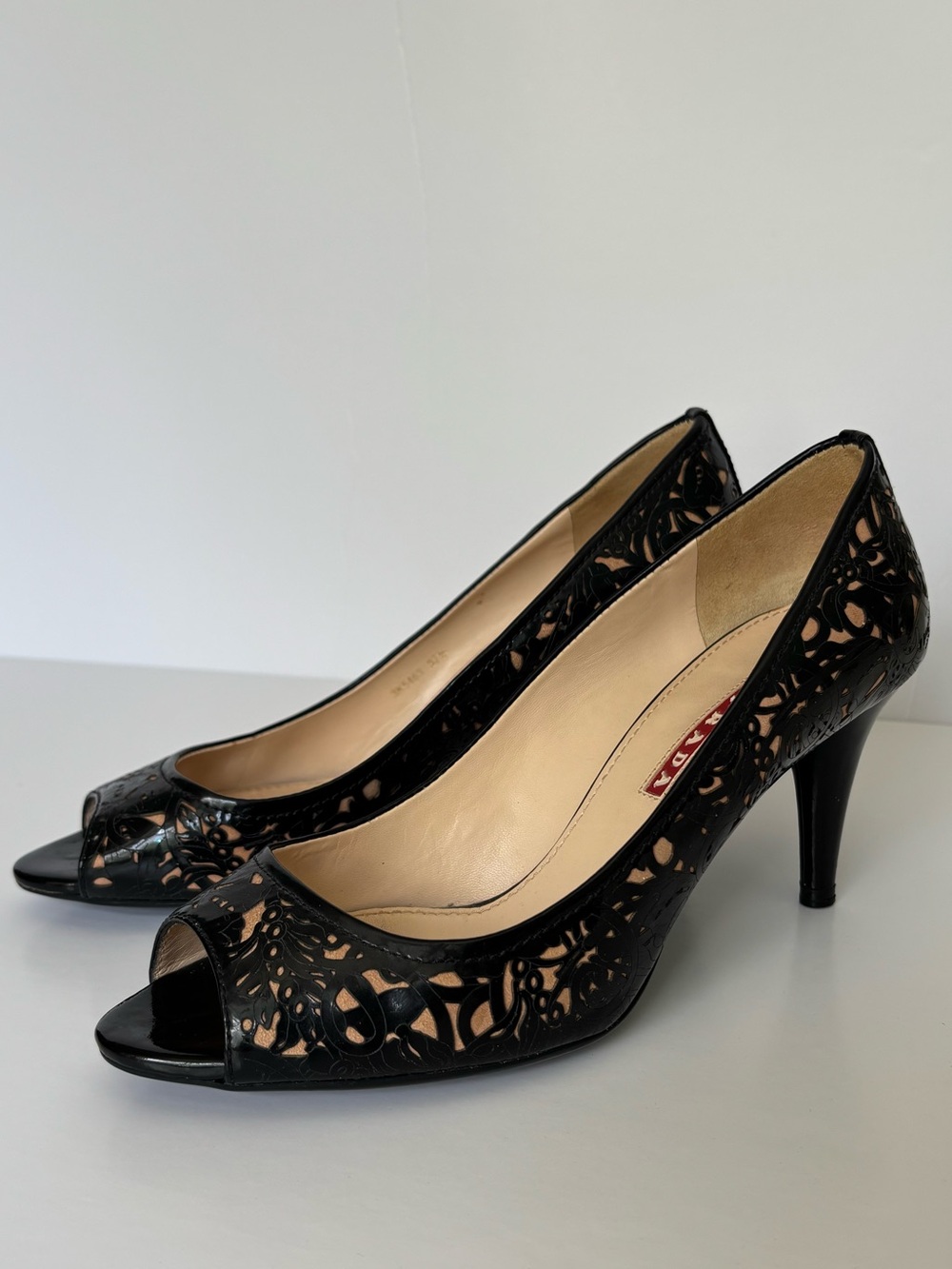 Prada Black Laser Cut Peep Toe Pumps (Size 37.5)
